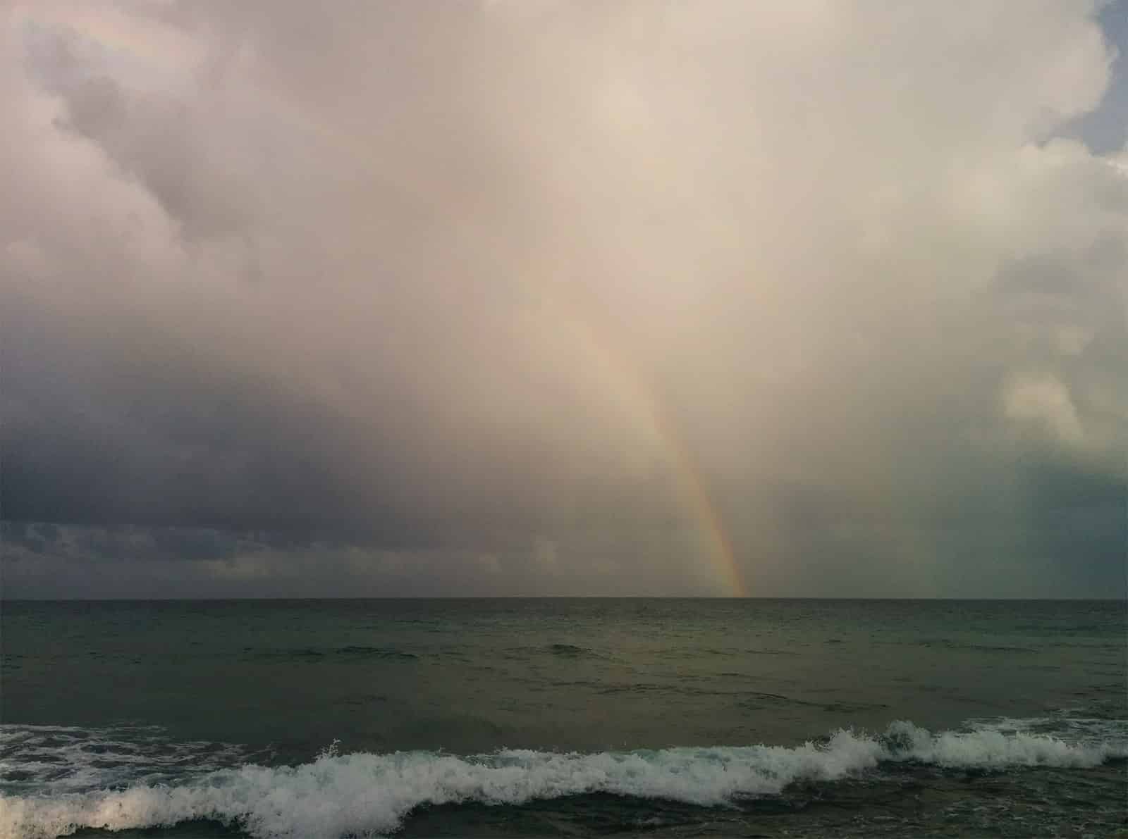 Rainbow over the ocean after a rain storm in the Maldives